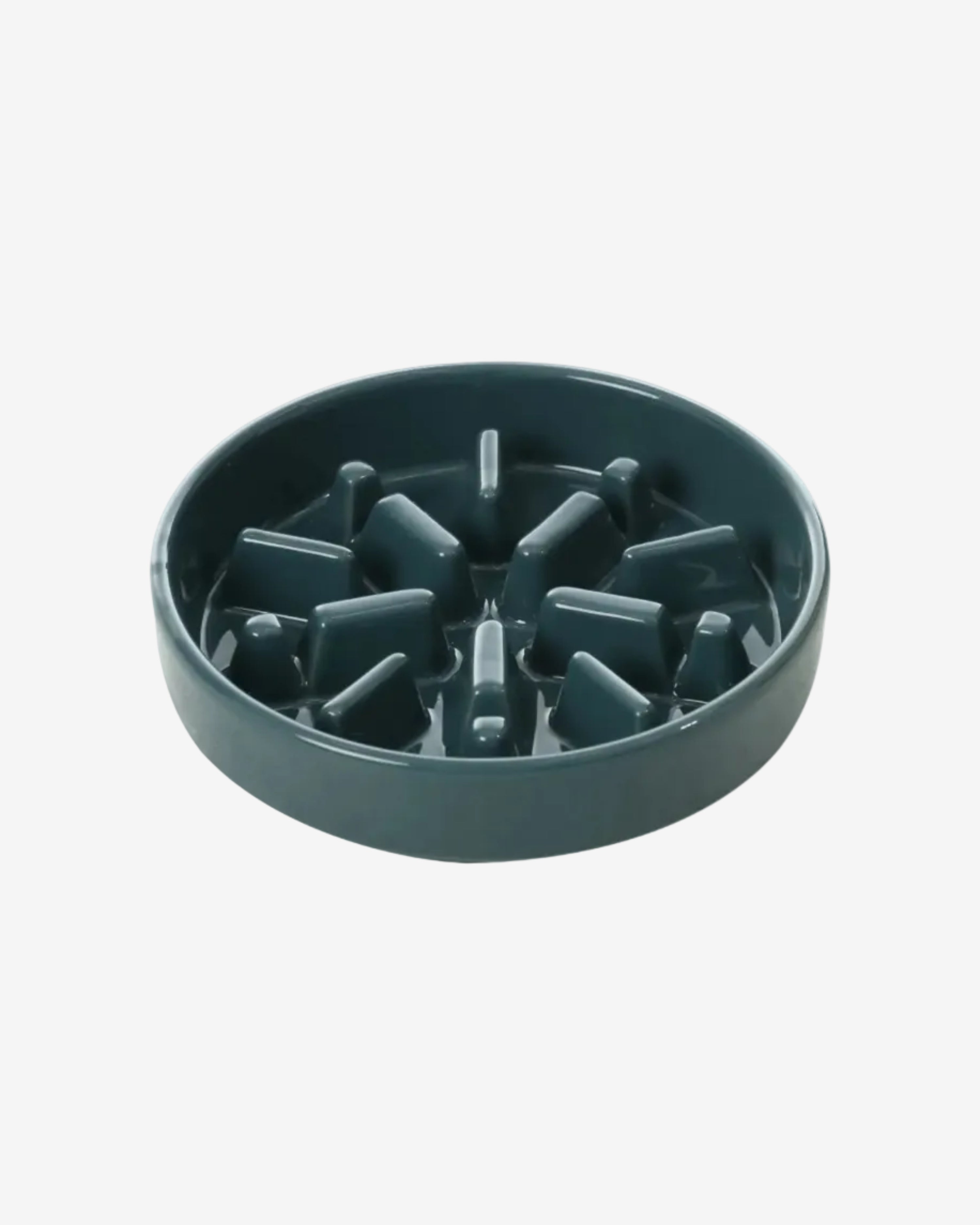 Blue spark-shaped slow feeder dog bowl on a white background