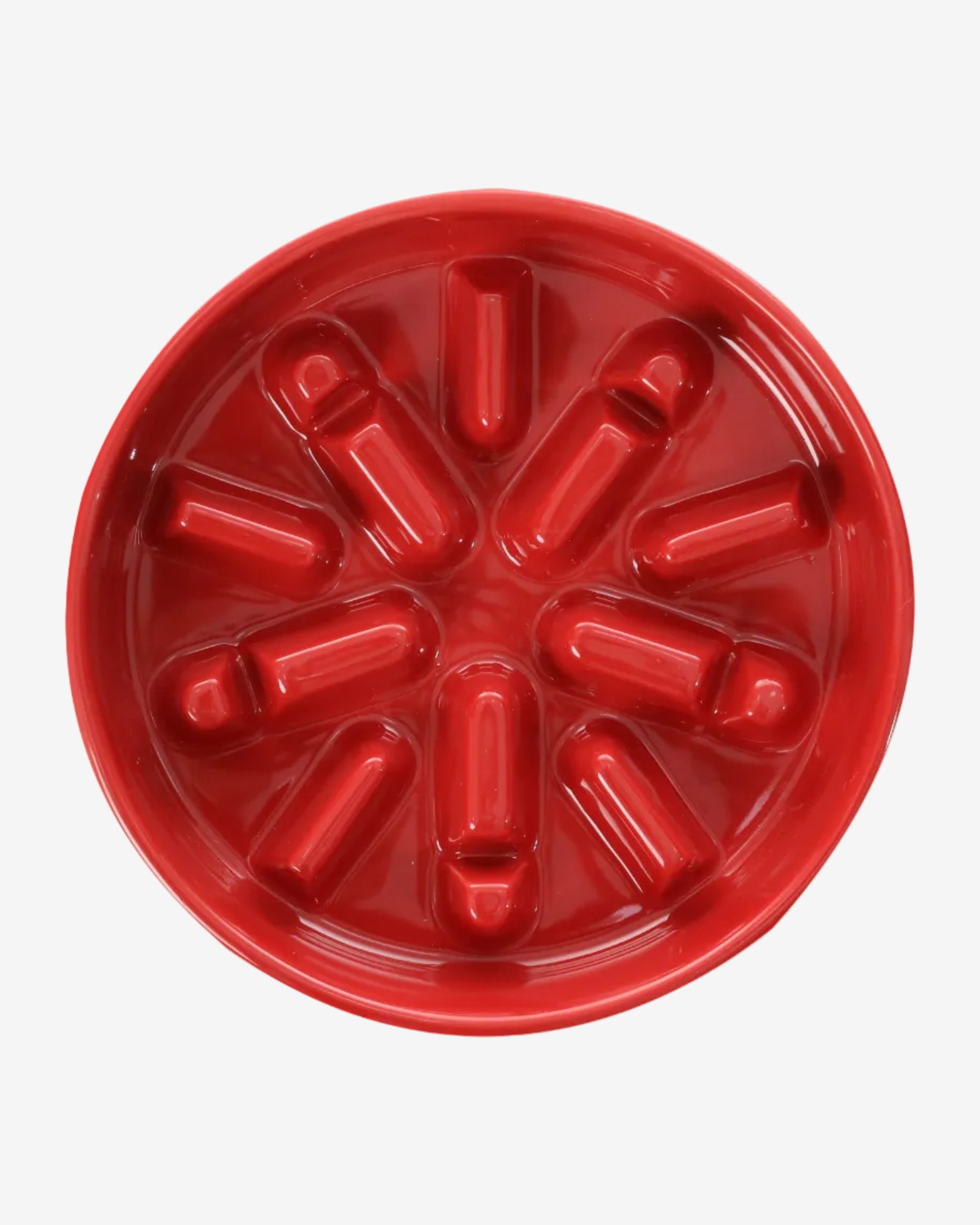 Red ceramic spark-shaped slow feeder bowls on a white background