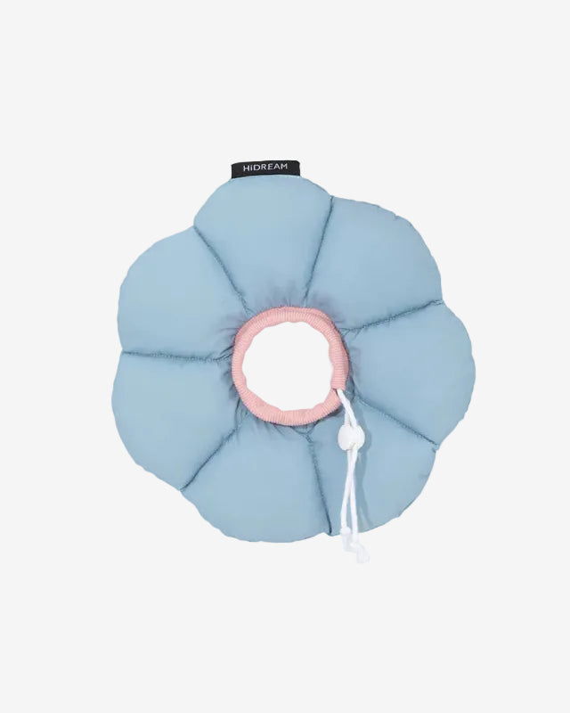 Blue pet recovery collar with pink center and white tag on a light gray background