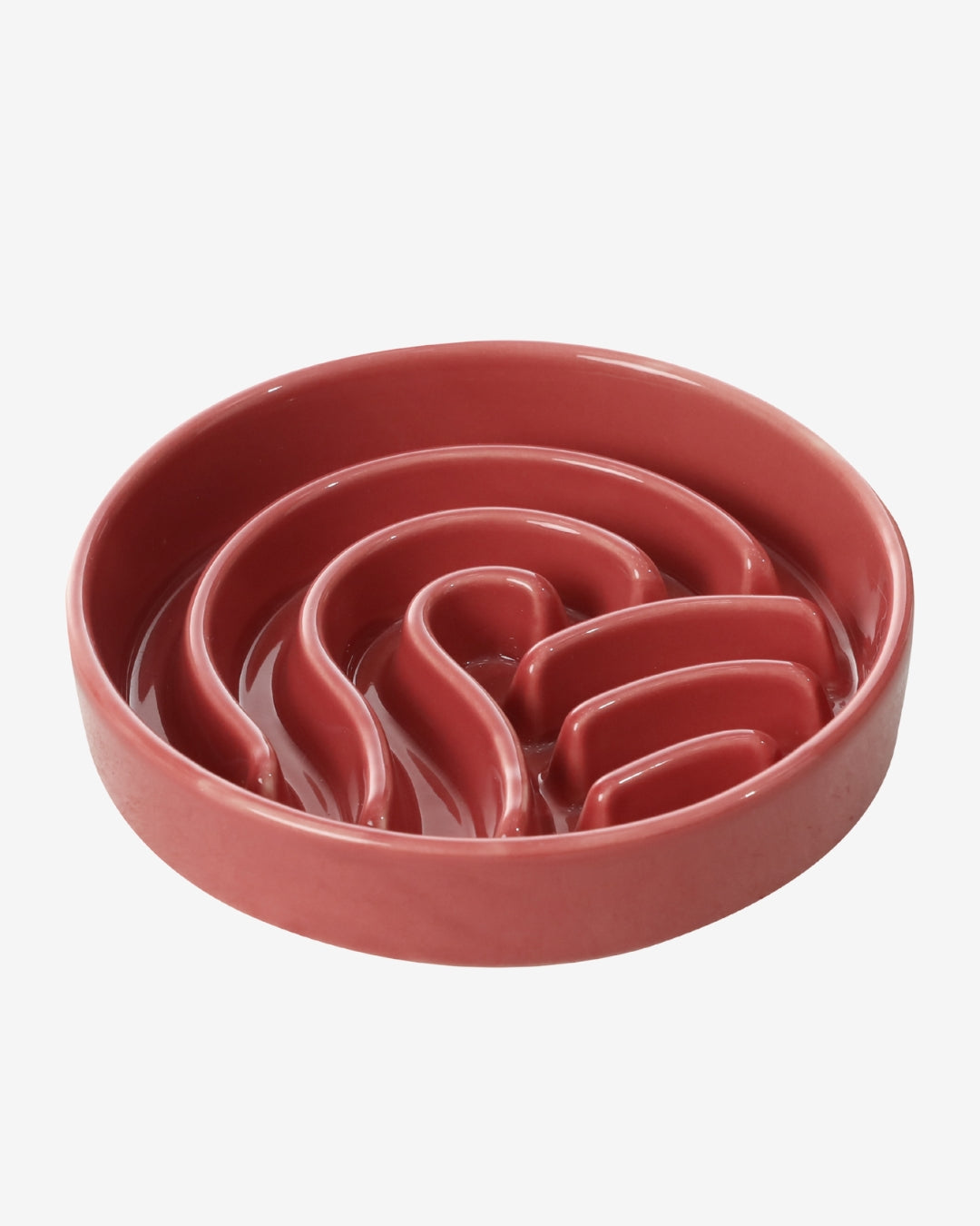 Red wave-shaped ceramic slow feeder dog bowl on a white background