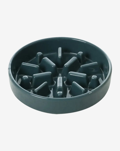 Blue spark-shaped slow feeder dog bowl on a white background